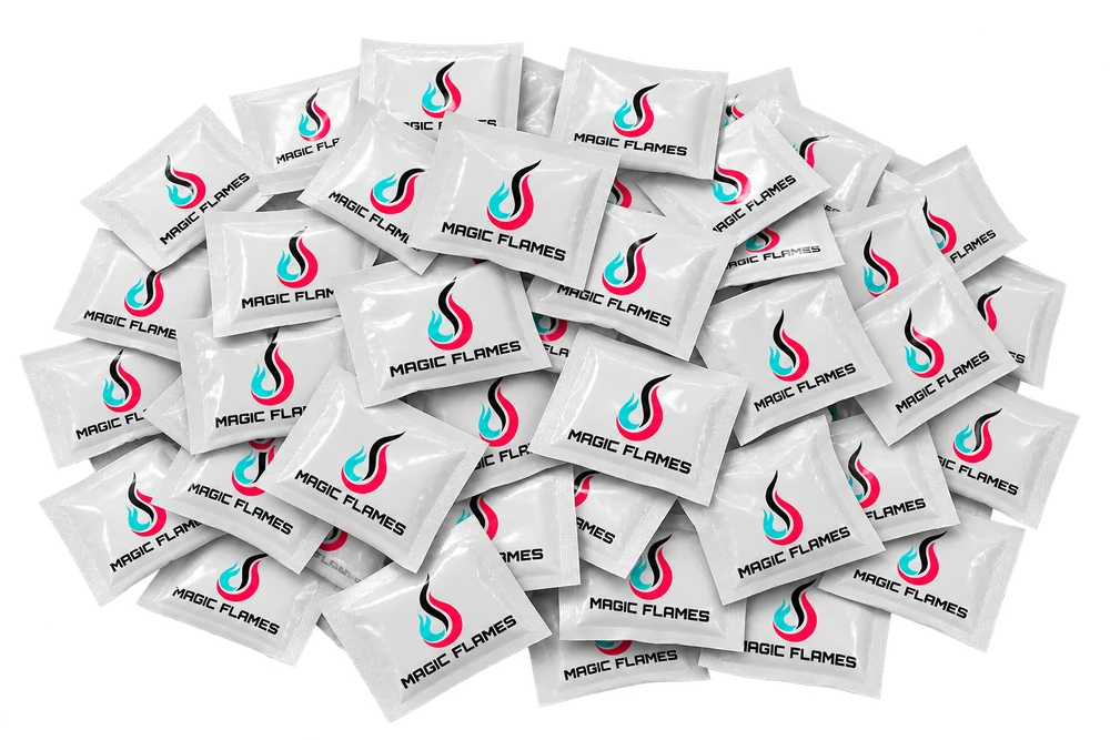 Magic Flames 100 pack of fire color changing packets scattered on white